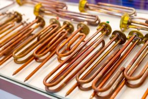 New copper heating elements for water boilers, closeup. Heaters for washing machine